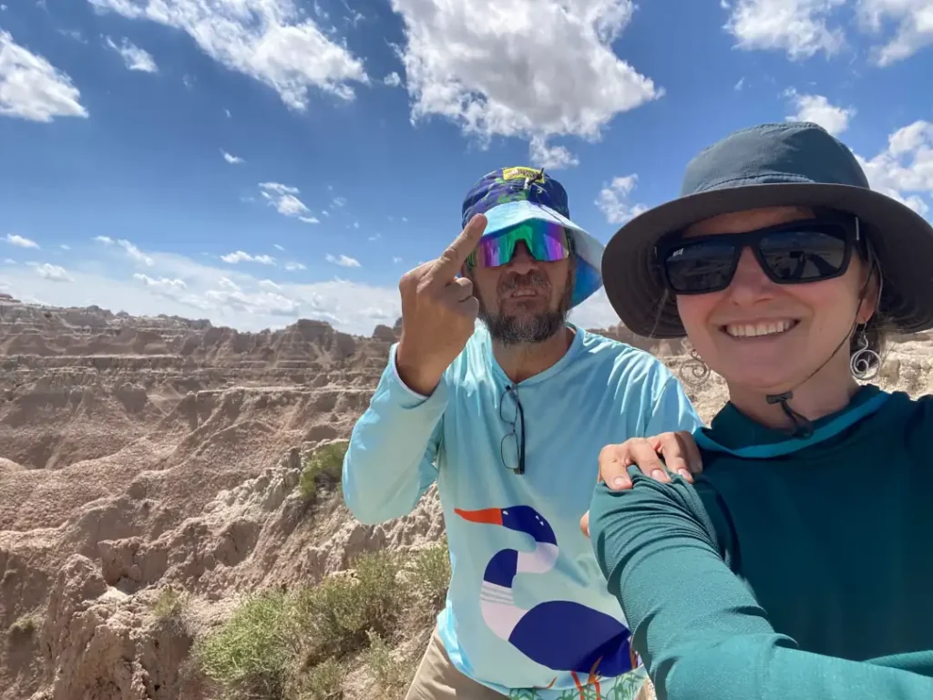 A couple poses in the badlands
