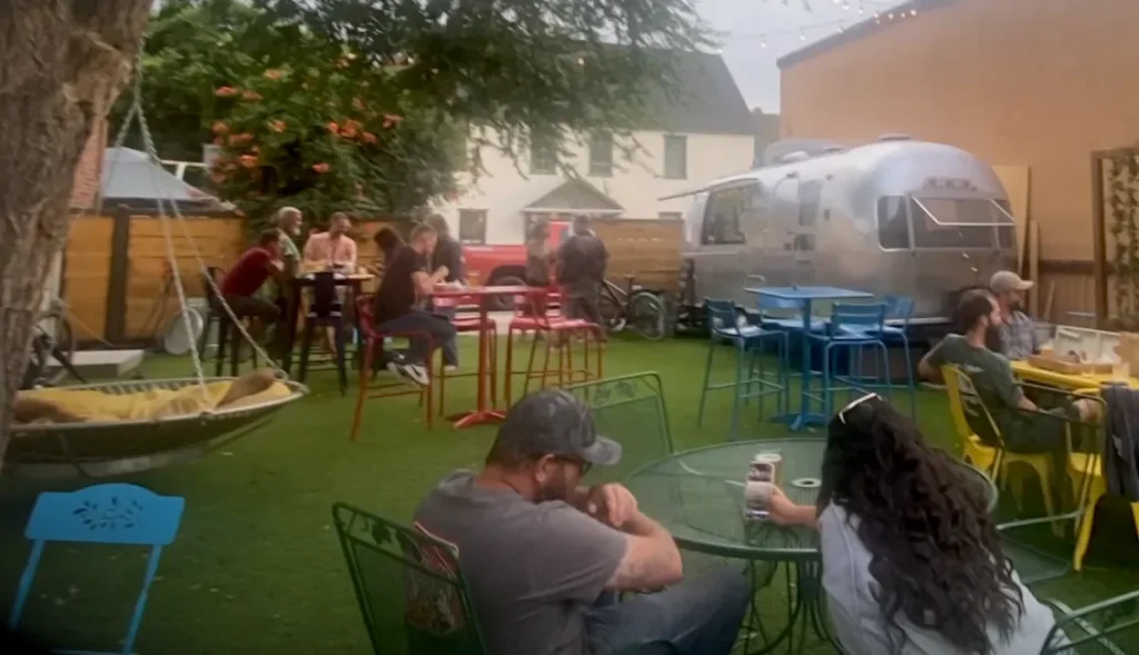 A colorful outdoor setting is the backdrop for afternoon cocktails